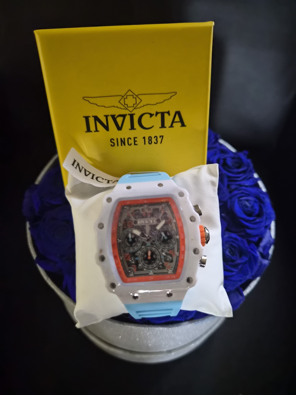 Invicta White Case Watch with Light Blue Strap and Red Accents